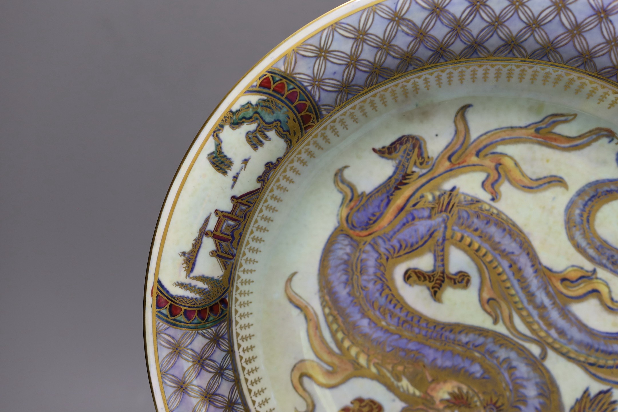 A large Wedgwood lustre dragon shallow bowl, designed by Daisy Makeig-Jones, pattern no. Z4829, 28cms diameter